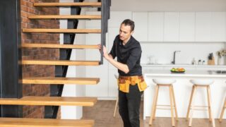 the worker is repairing the stairs