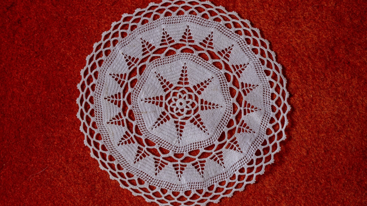 Handcrafted lace tablecloth, coffee table cover. Warm white or beige vintage knit lace. Crochet lace handcrafted lace texture.