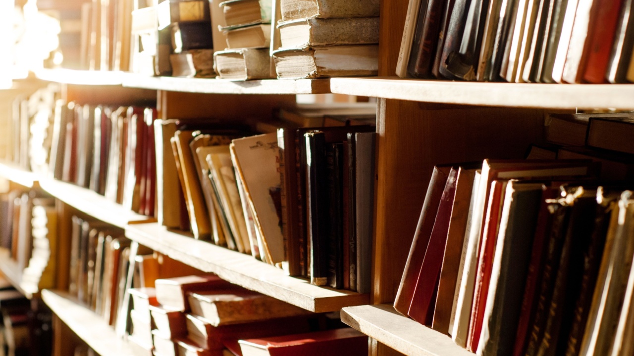 Old used books on the shelves in a thrift store. Swap and bookcrossing. Sustainable Living