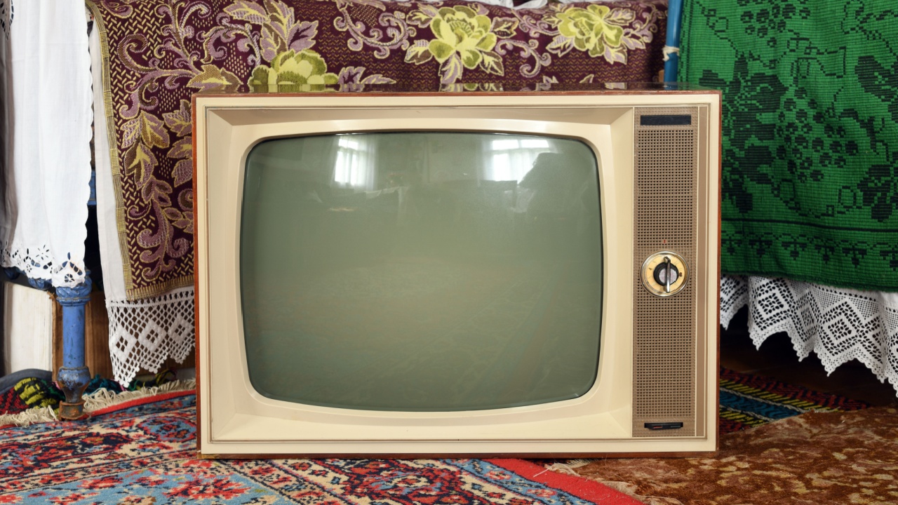Old vintage TV in a rustic interior.