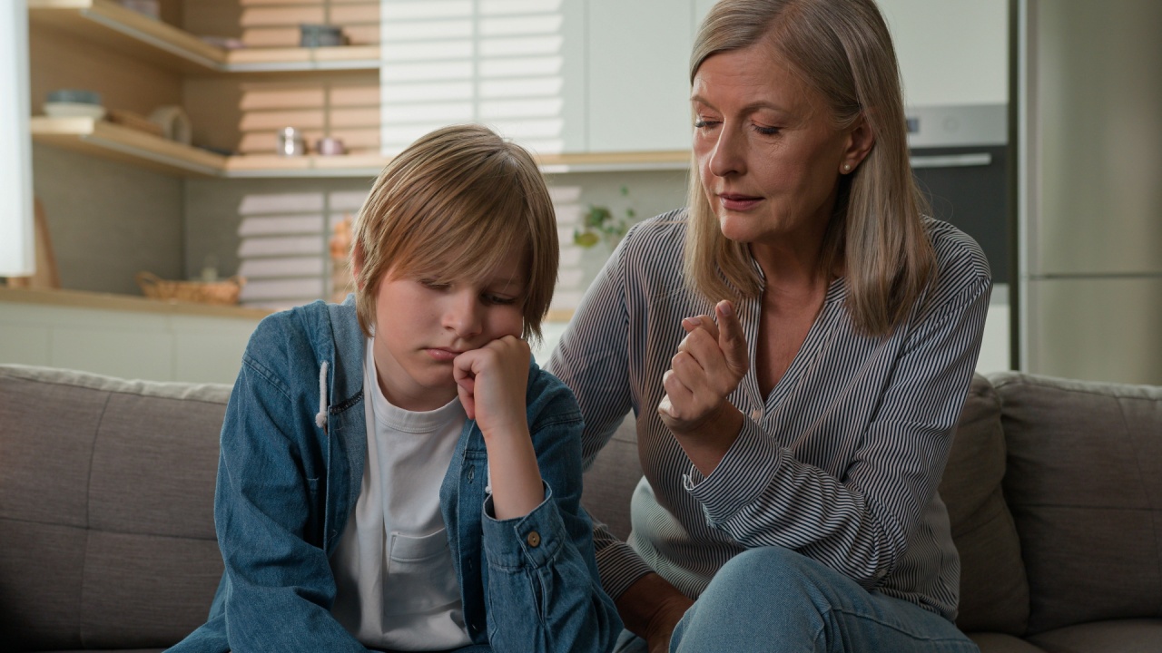 Strict angry elderly senior Caucasian woman grandmother punishing disobedient lazy offended grandson at home scolding grandchild kid boy due to bad behavior discipline family conflict explaining rules