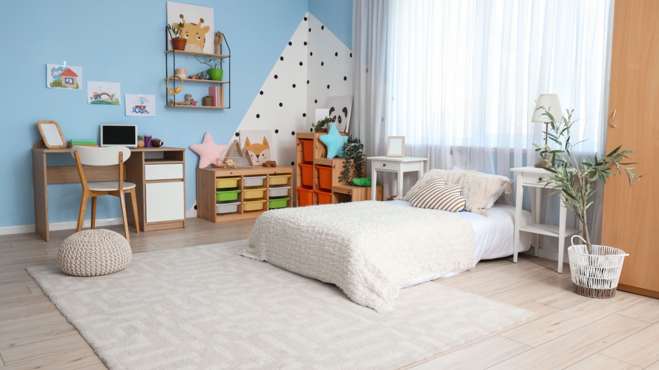 Interior of children's room with bed, tables and shelves