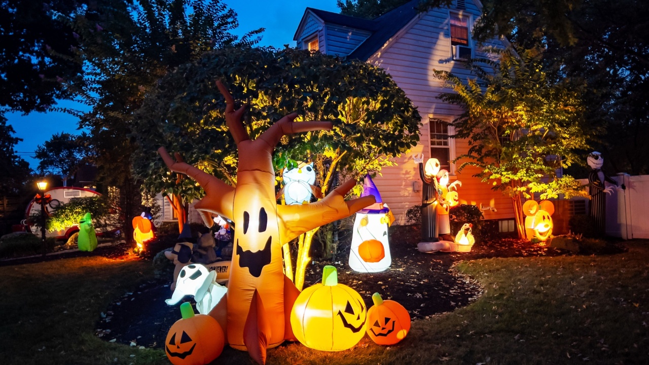 Spooky and cute Halloween outdoors illuminated decorations at night