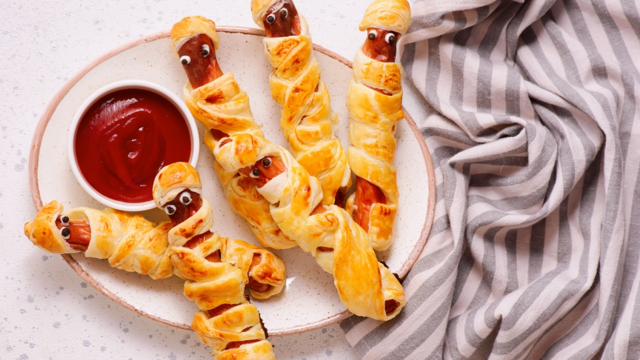 Mummy Sausages with Ketchup for Halloween.top veiw .selective focus