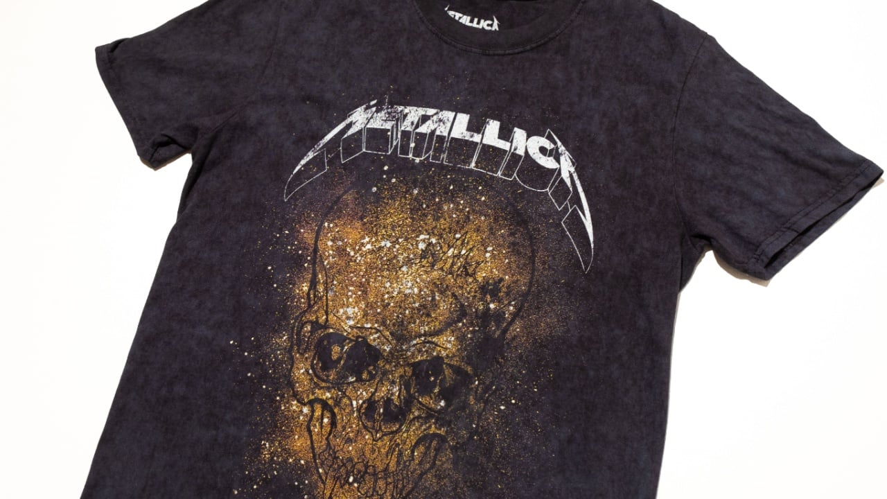 kent, uk 01.01.2023 Official Metallica tour Merchandise T-Shirt small Black With A Yellow Gold Skull Tour Rock Tee Graphic. rock and roll merchandise. Heavy metal skull band.