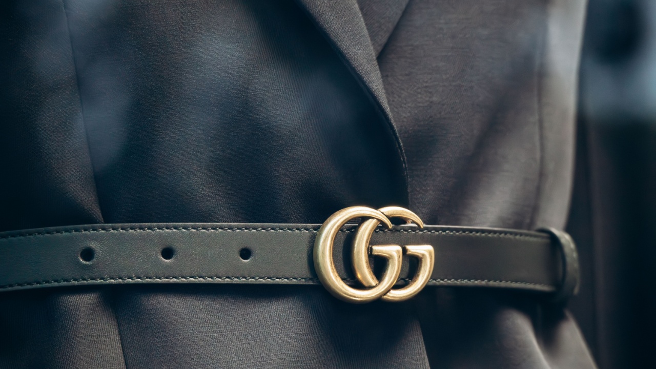 Cannes, France - November 5, 2024: Close-up of Gucci belt over black jacket in boutique window in Cannes