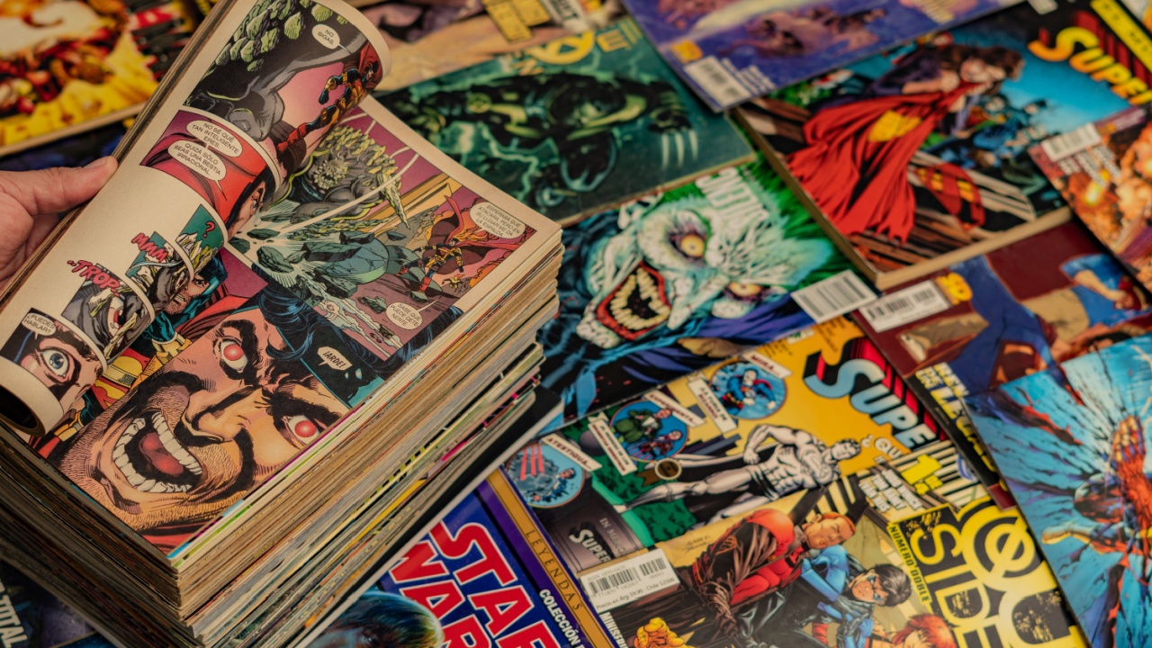 Guayaquil, Ecuador - AUG 10, 2024: Collection of comic books with open page showing vibrant superhero action scenes. Perfect for pop culture and nostalgia themes. Collection of Vintage Comic Books.