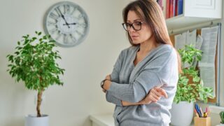 Middle aged unhappy thoughtful suffering lonely woman, at home