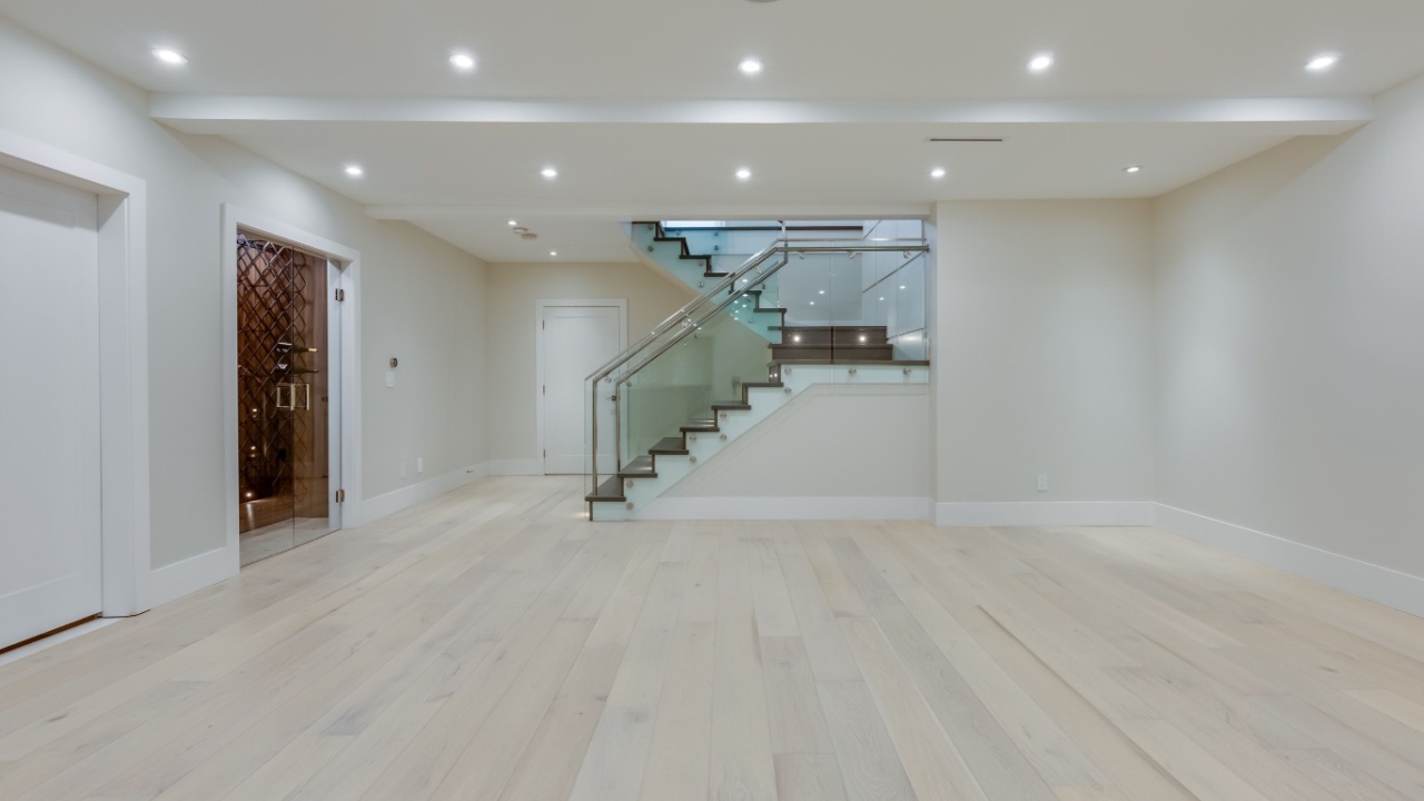 Empty basement in a newly built house with stairs