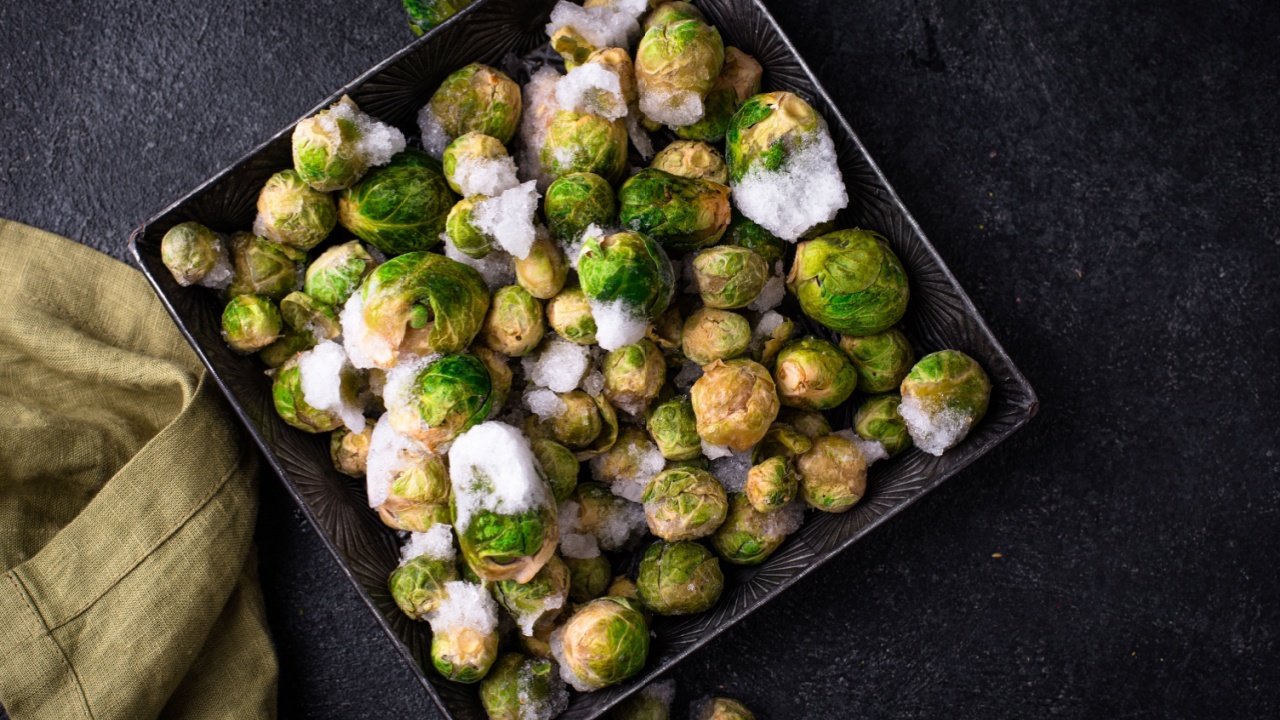 Frozen Brussels sprouts on dark background