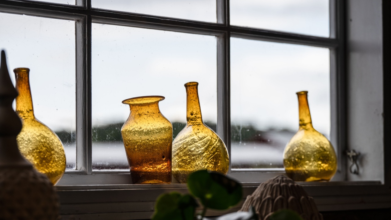 amber glass vases on window sill with natural light