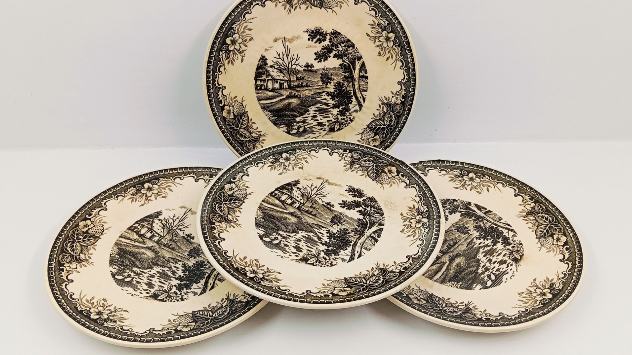 A beautiful set of four vintage landscape plates with intricate black and white designs, perfect for collectors or elegant dining. #VintagePlates #LandscapeDecor #AntiqueTableware #CollectibleCeramic