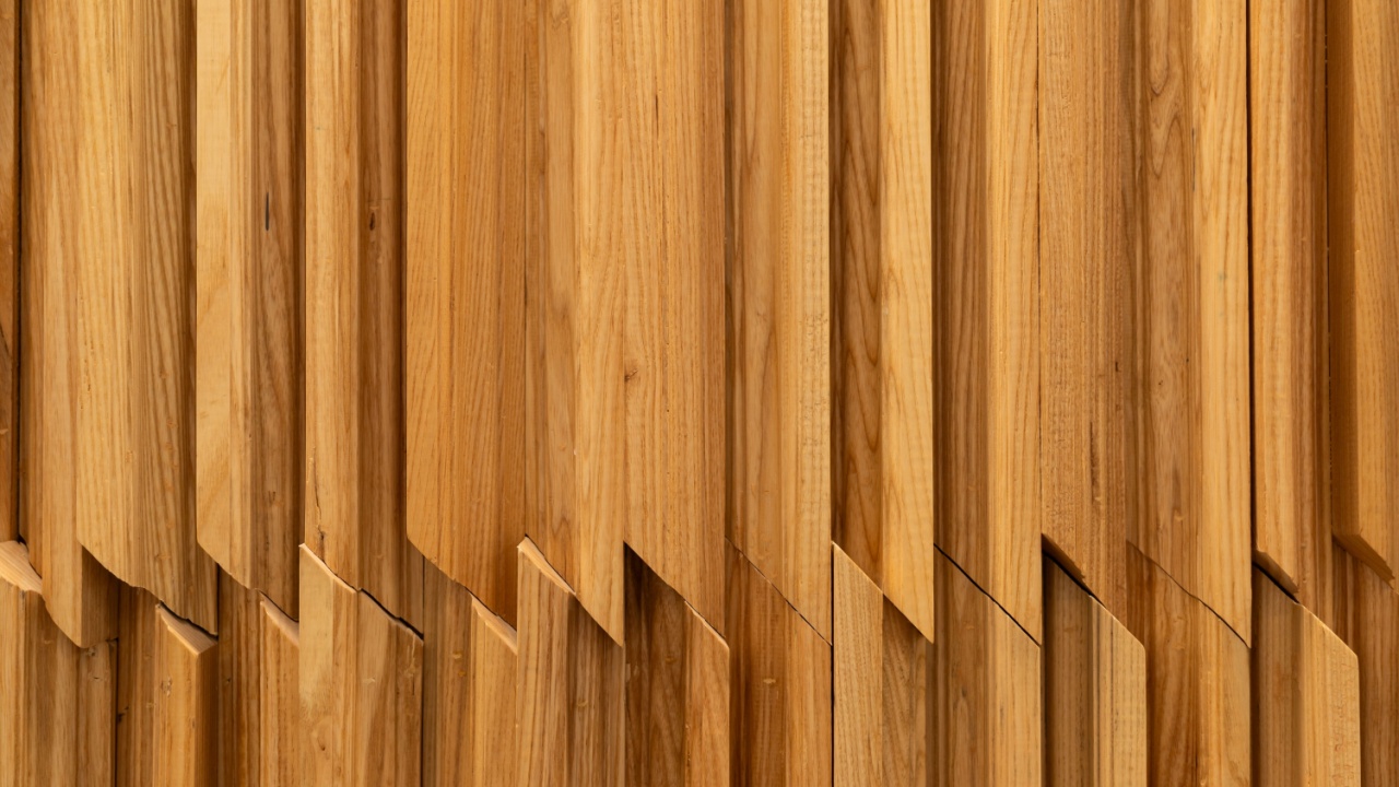 Geometric Wooden Wall Texture with Vertical Panels. a modern architectural wooden wall featuring vertically aligned wooden slats with angular, geometric cuts.
