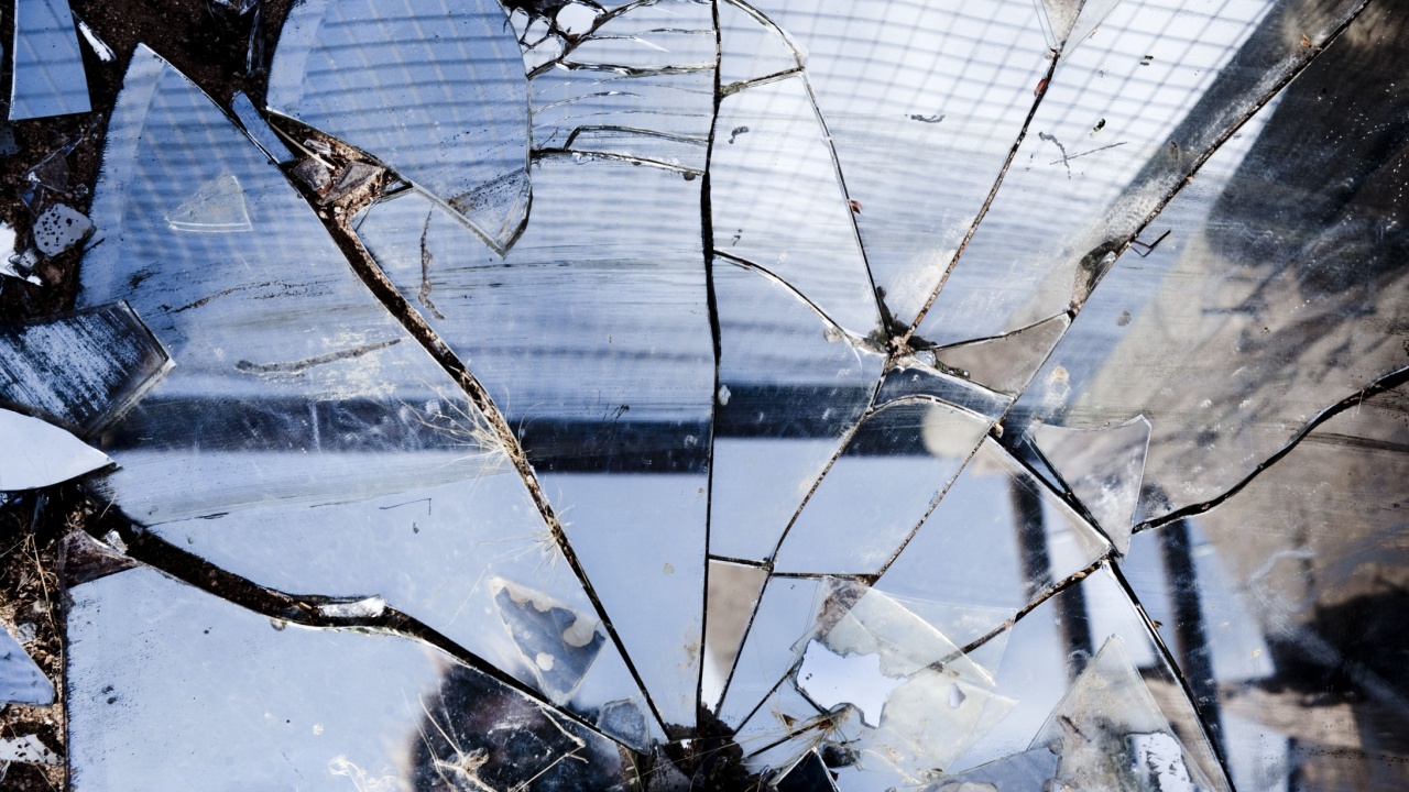 Broken mirrors make a beautiful reflection in the sun, left in the desert amongst trash and found pieces of art and garbage.