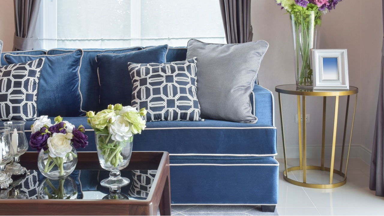 Navy blue modern classic sofa set with beautiful flower vases in nice living corner