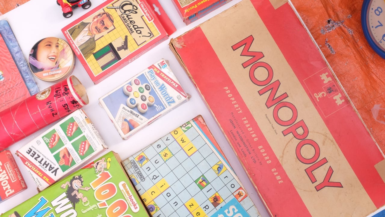 Ipoh, Malaysia - 2 November 2016 : Vintage on sale at a flea market in Pasar Karat Memory Lane, Ipoh, Perak. Monopoly is a board game that originated in the United States.