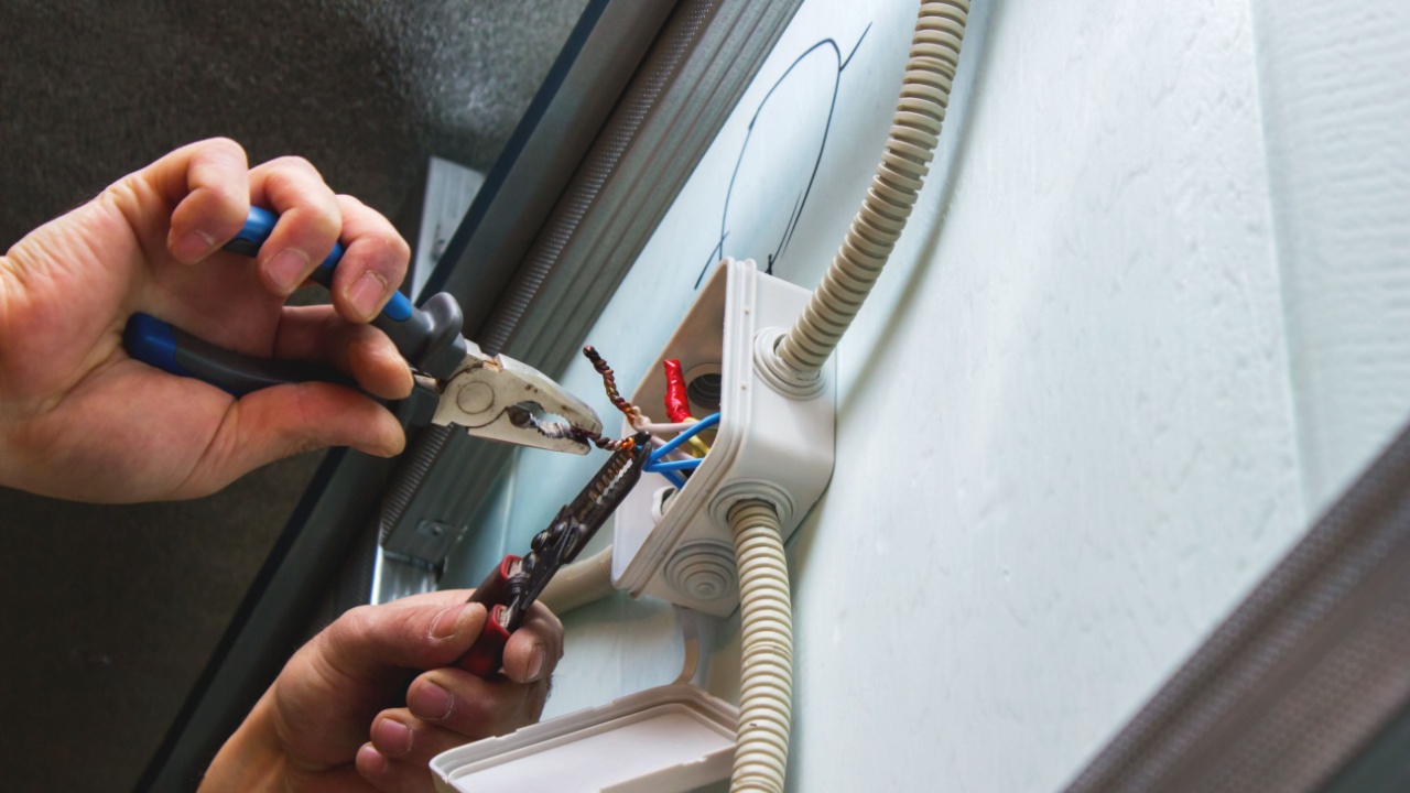 Installation of electrical boxes, the electrician mounts the electrical wiring inside the building