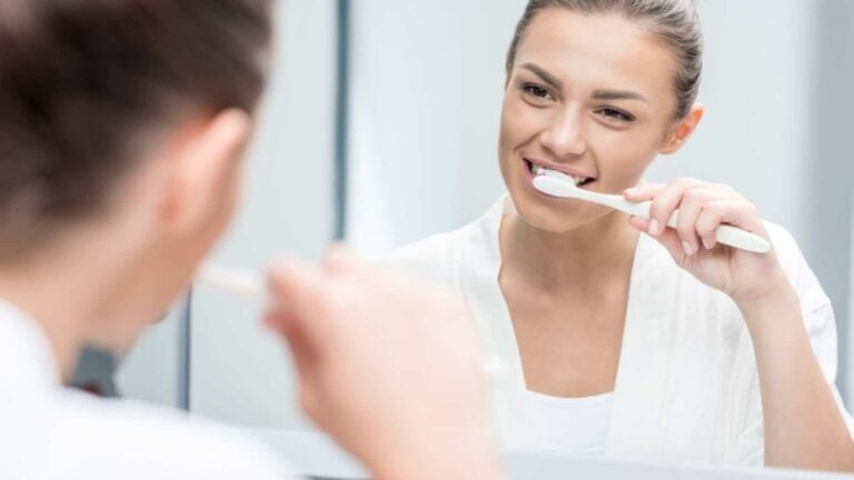 Woman brushing teeth