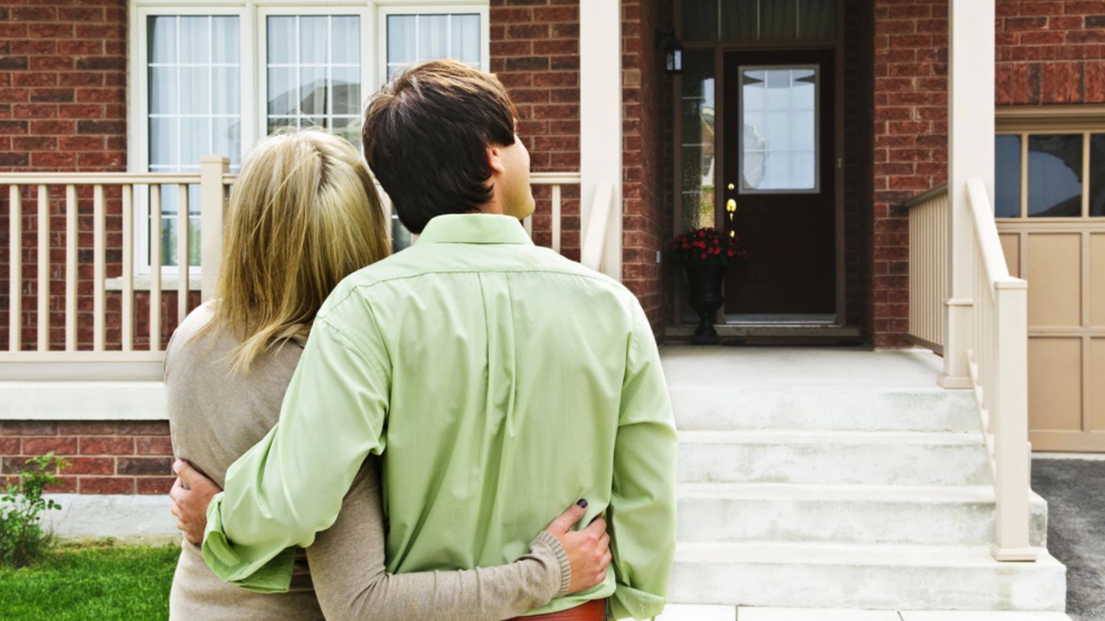 Young happy couple looking for new home