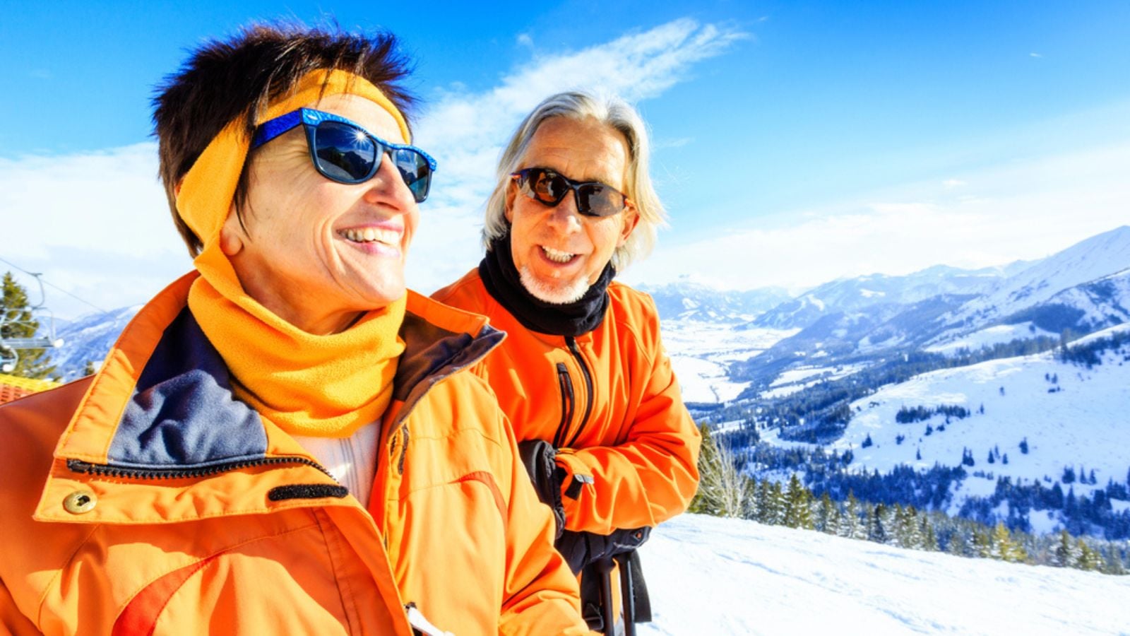 Active senior Couple In The Mountains, enjoying a clear winter day