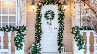 a front door decorated beautifully for Christmas