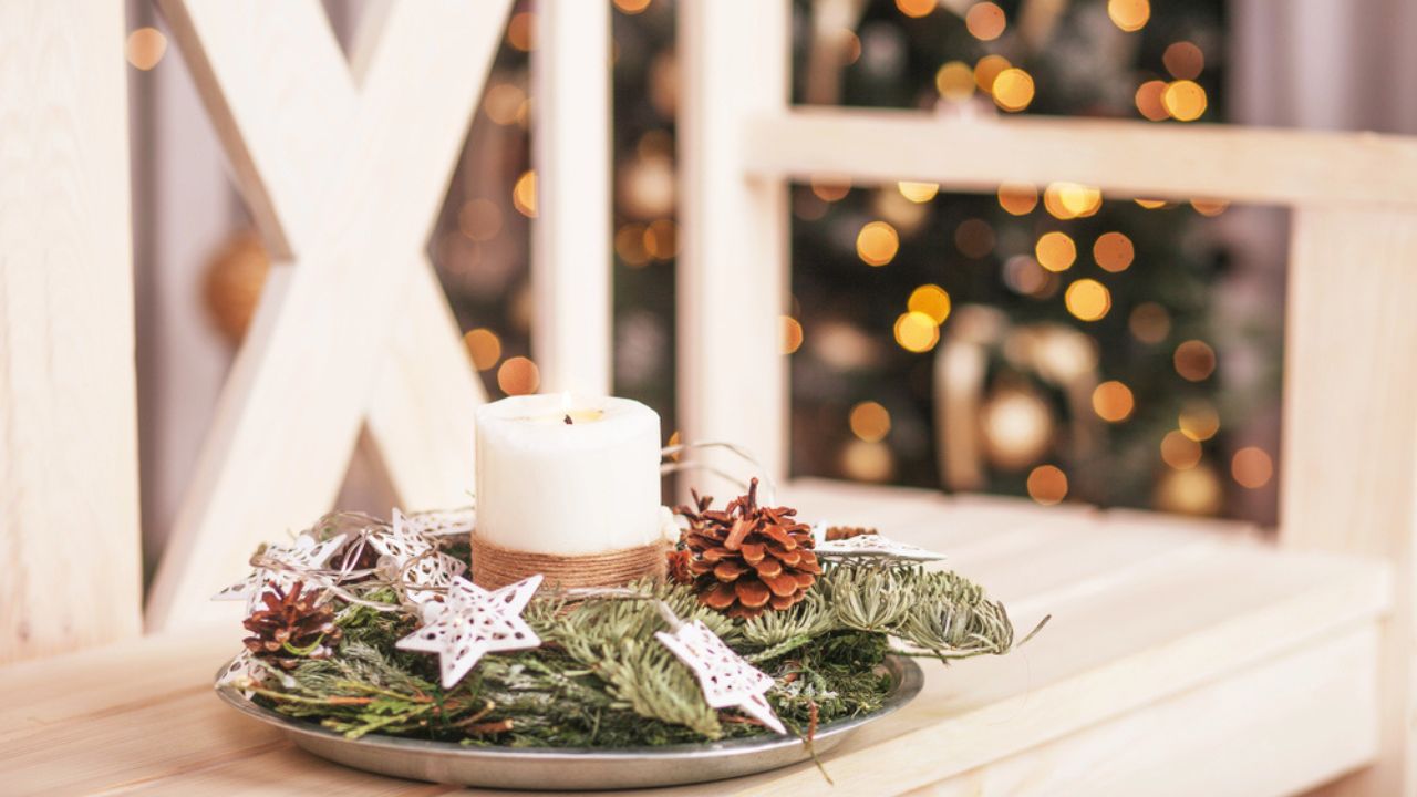 Christmas decoration with candles. Christmas card with holiday mood. Festive burning candles