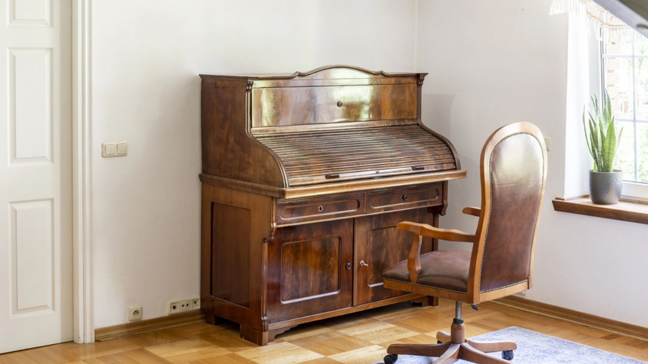 Classic piano and chair on wheels in an antique room interior