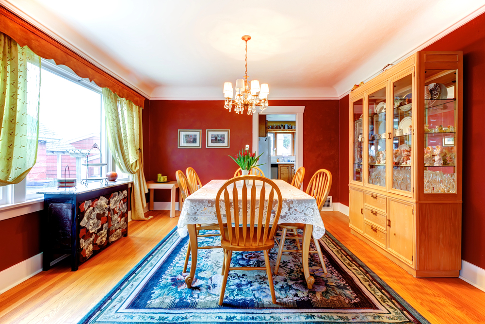 dining room wood floors, rug, bay window, hutch, dining room storage, chandelier