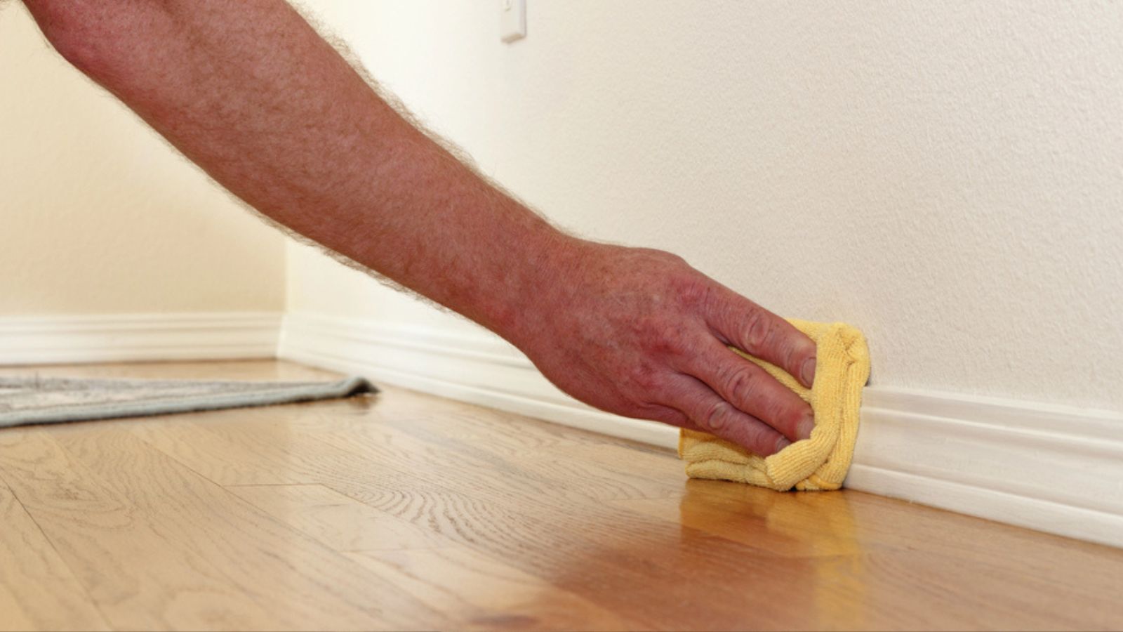 Dusting a Baseboard