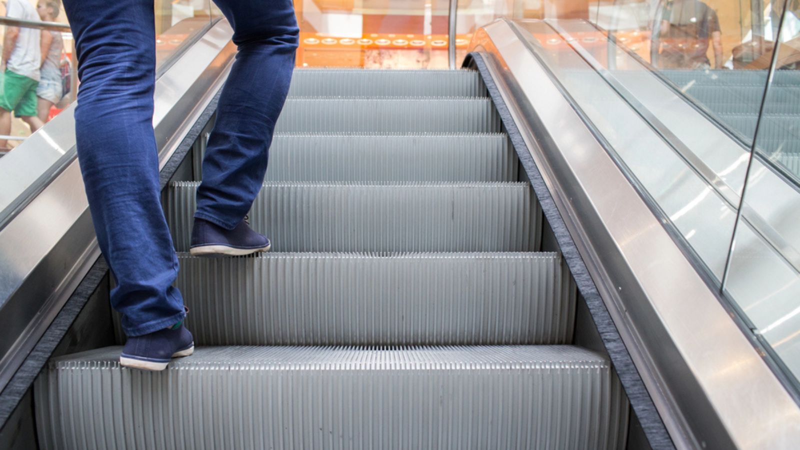 Escalator. Stairs lead people straight to the illusion of luxury, to the store.