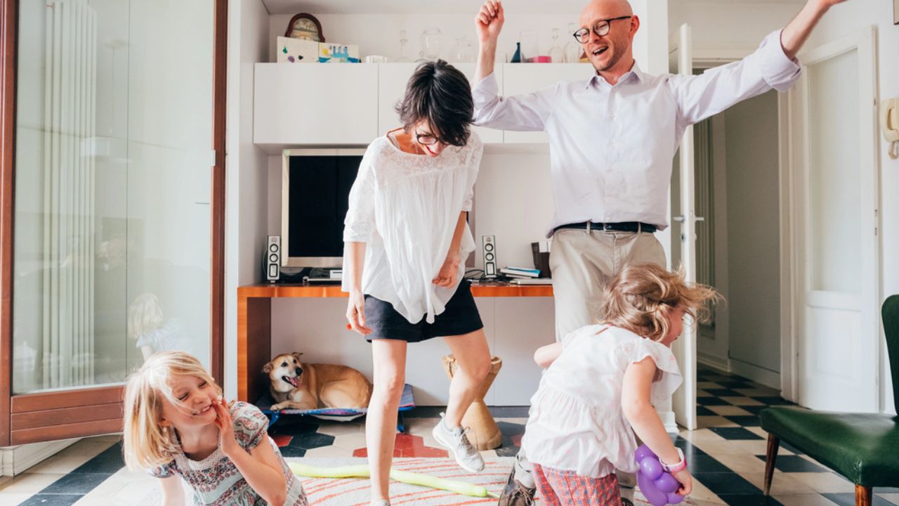 Happy family indoors at home playing - togetherness, spending time, happiness concept