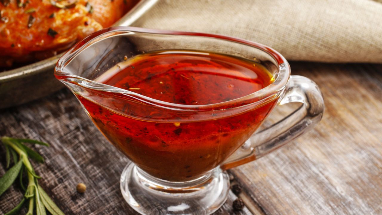 Honey and pepper red marinade in glass gravy boat