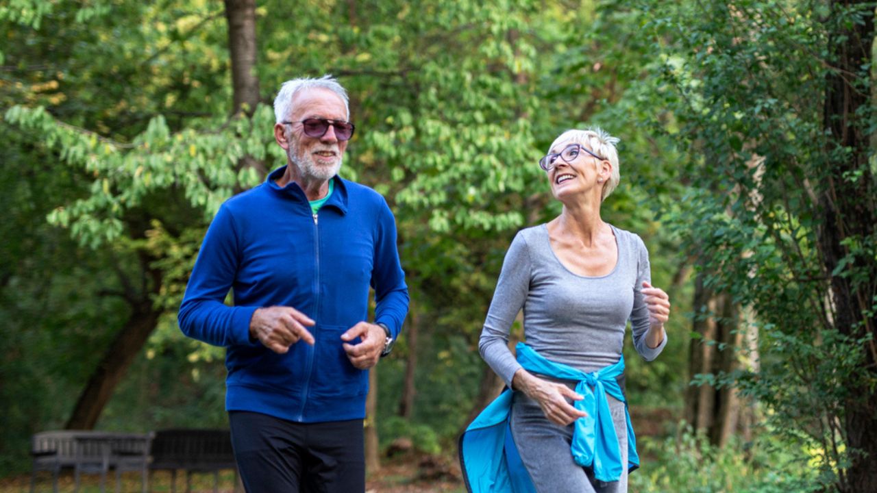 Old couple in the public park running