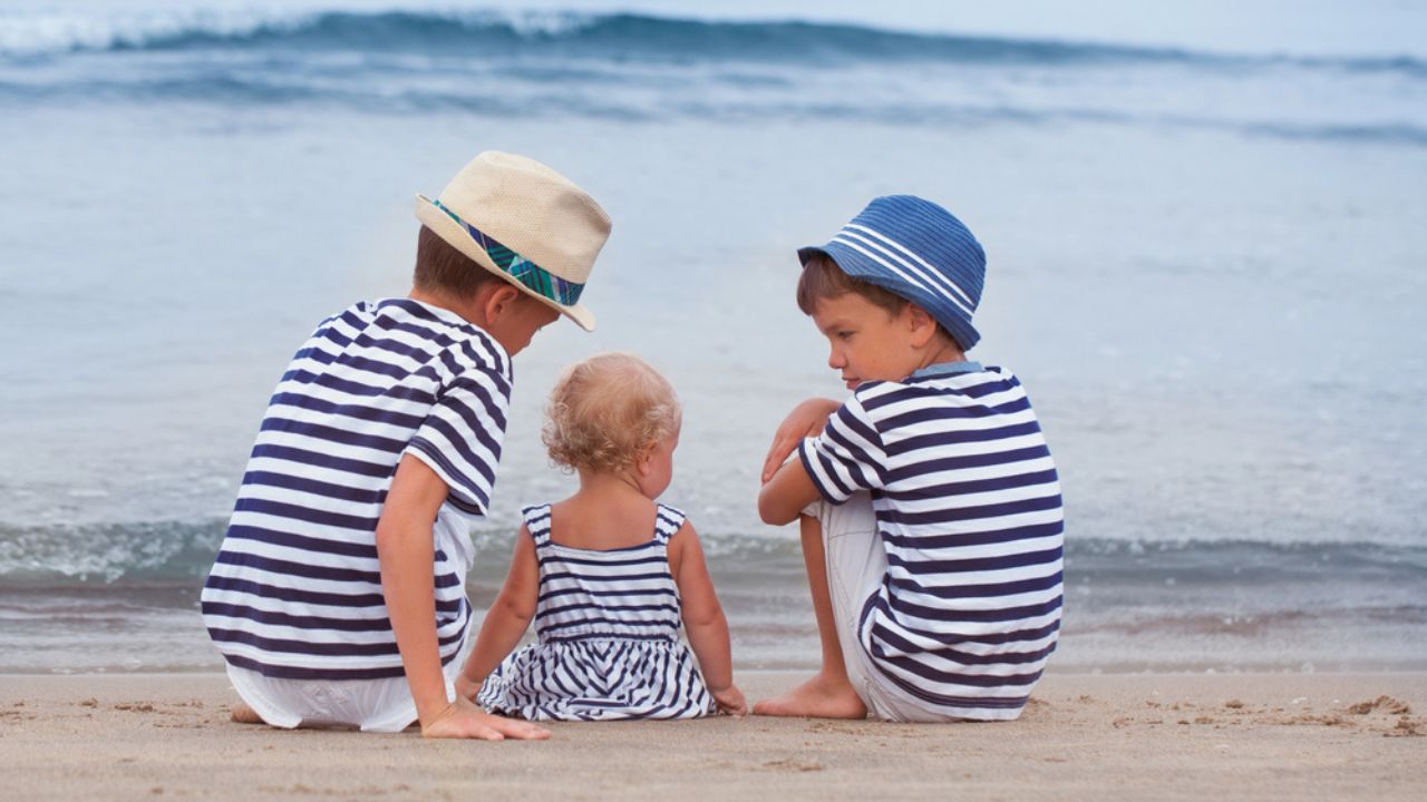 Portrait of happy brother and little sister