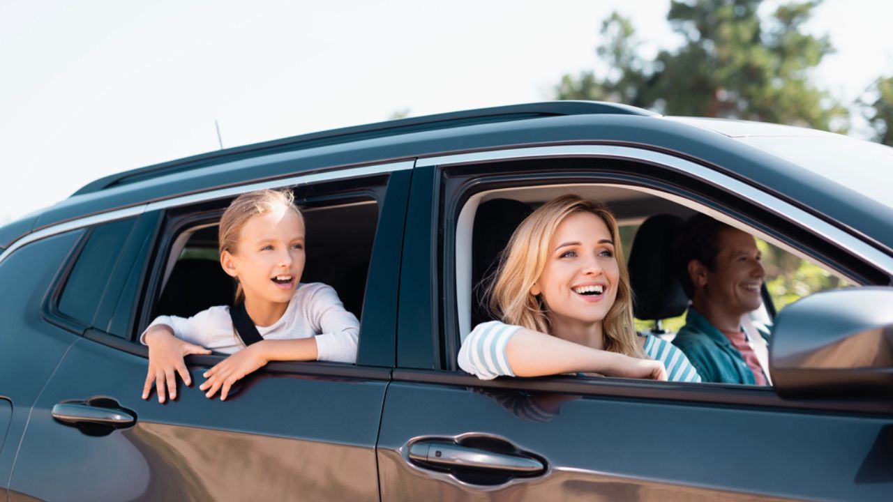 Selective focus of woman looking away during weekend on car with family