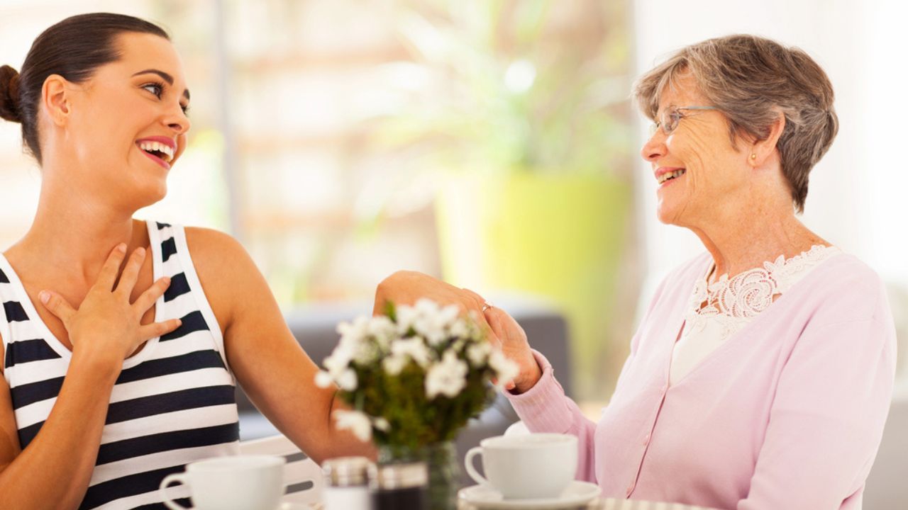 Senior grandmother looking at granddaughter's new ring