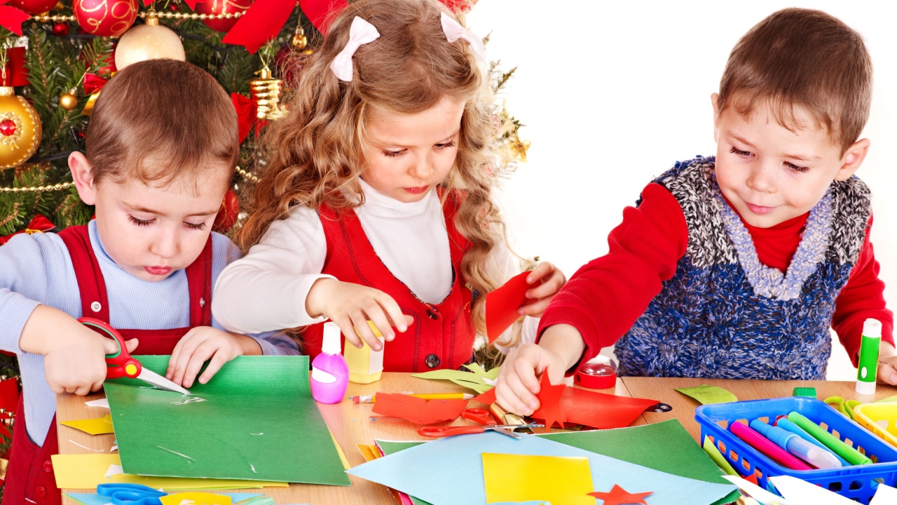 Children boy and girl making decoration for Christmas.