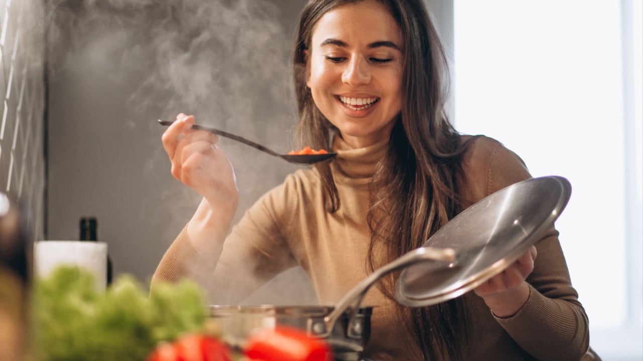 Woman cooking at kitchen