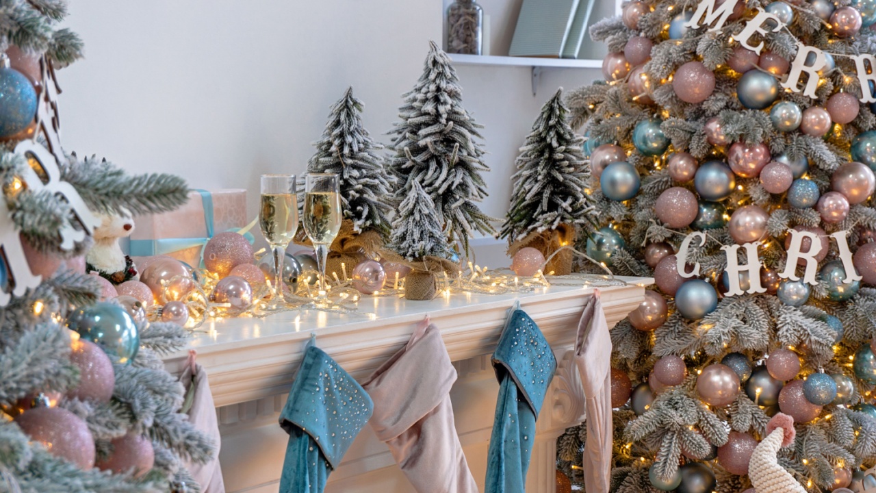 Closeup of white living room with big windows and Christmas New year decor,light garland and champagne glass