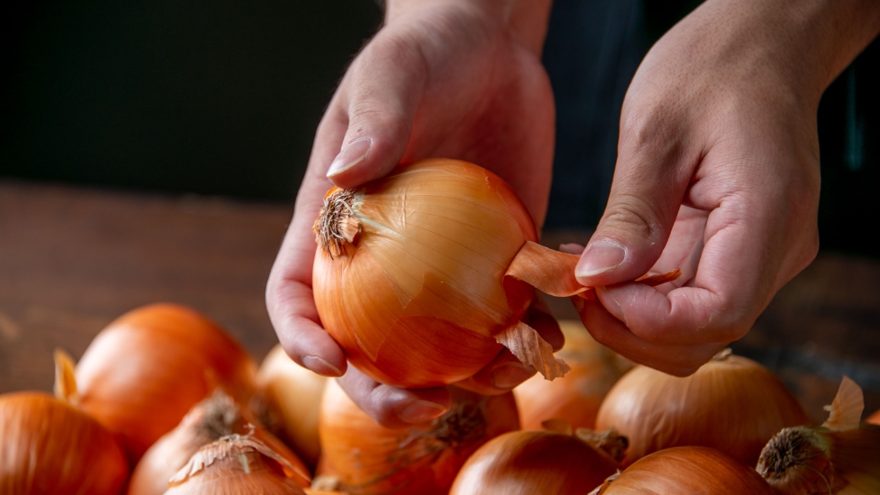 Peeling an onion.Cooking image.