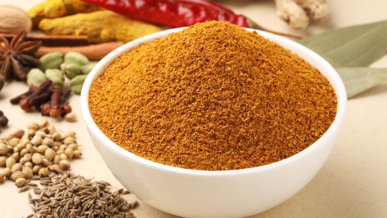 Curry Masala Powder with ingredients for curry masala, Indian spice. Selective focus