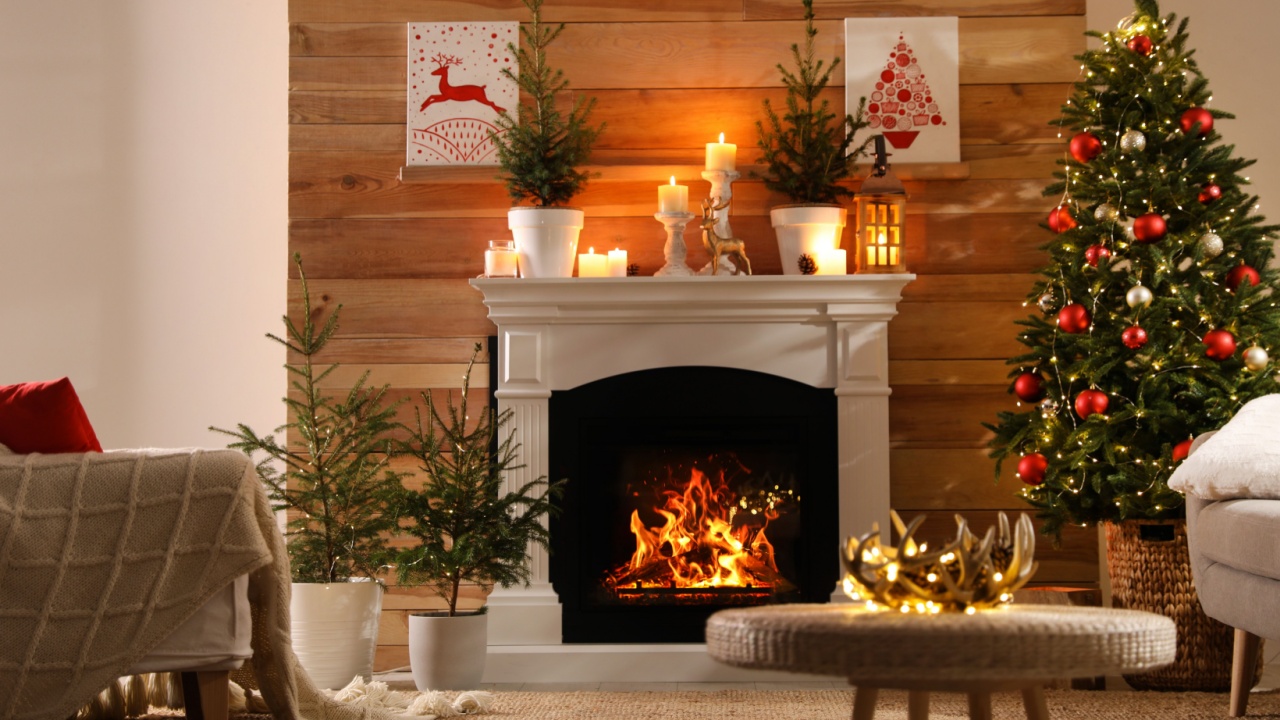 Beautiful room interior with potted firs, fireplace and decorated Christmas tree