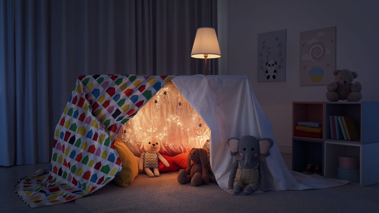 Play tent decorated with festive lights in modern child's room