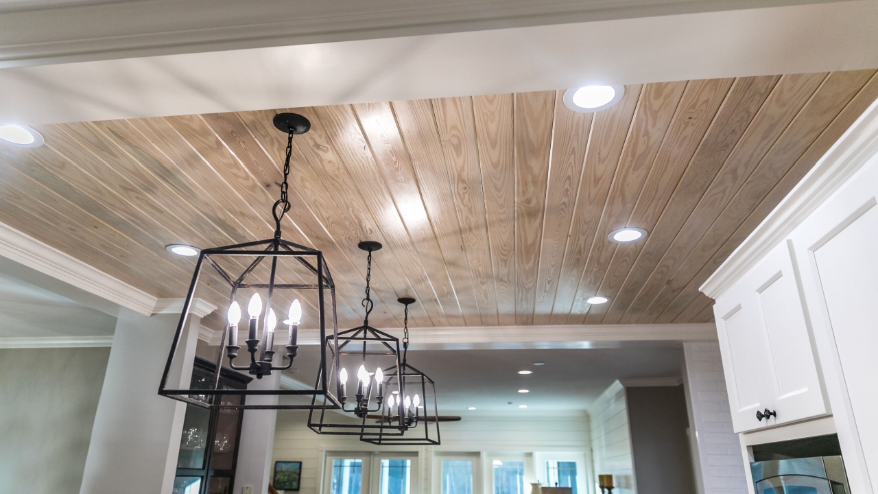 Hanging black metal iron lighting fixtures in a newly renovated kitchen