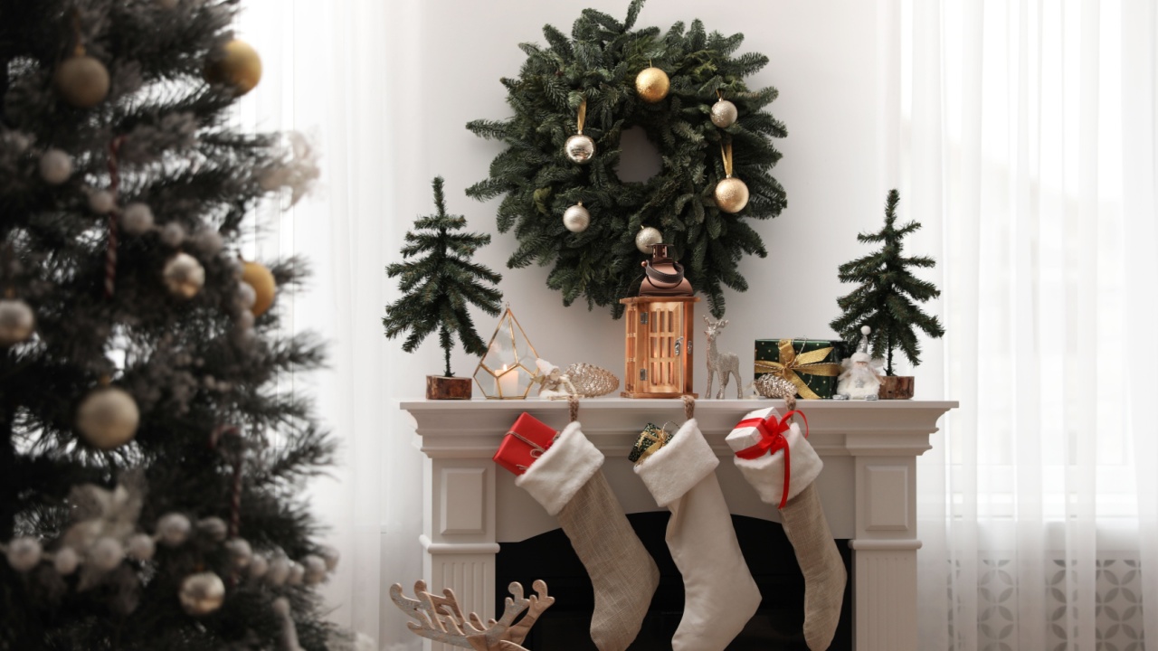 Fireplace in room with Christmas decorations. Interior design