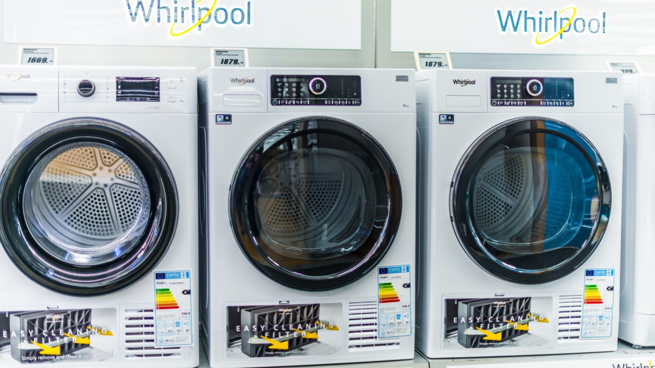 POZNAN, POL - FEB 24, 2021: Front-loader washing machines by Whirlpool put up for sale in a household goods store