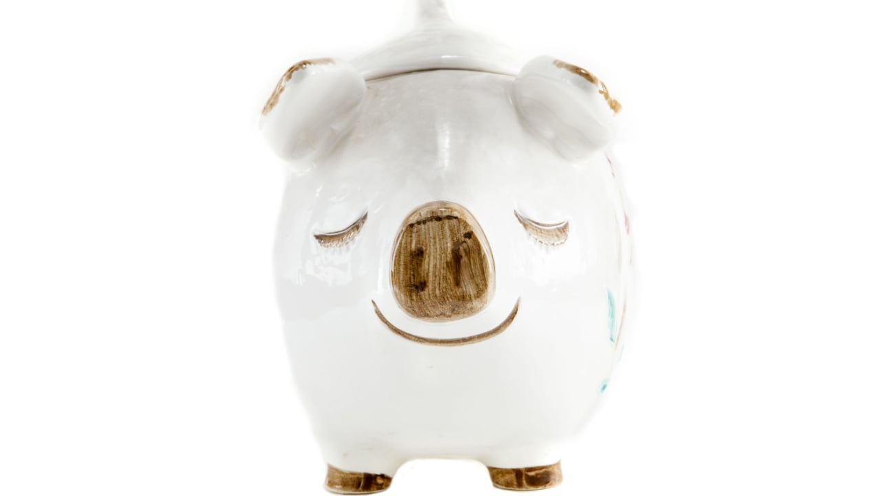 A Cookie Jar shaped like a pig against a white background