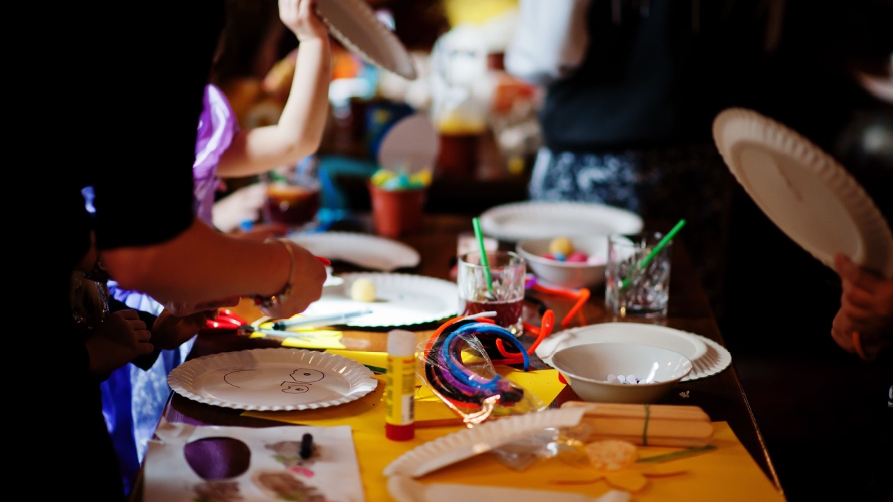 Preparing to Easter concept. Kids making by hands bunny and eggs.