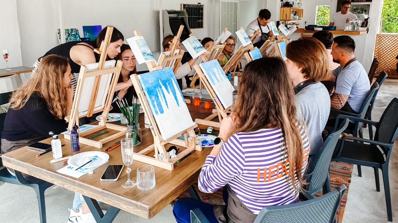 Turkey Marmaris 01.04.2023 Painting masterclass. Art party in restaurant. Glass of wine. Aquarelle watercolor, acrylic paints. Beginners class. Seascape nautical marine theme, sea boats, ships sails.