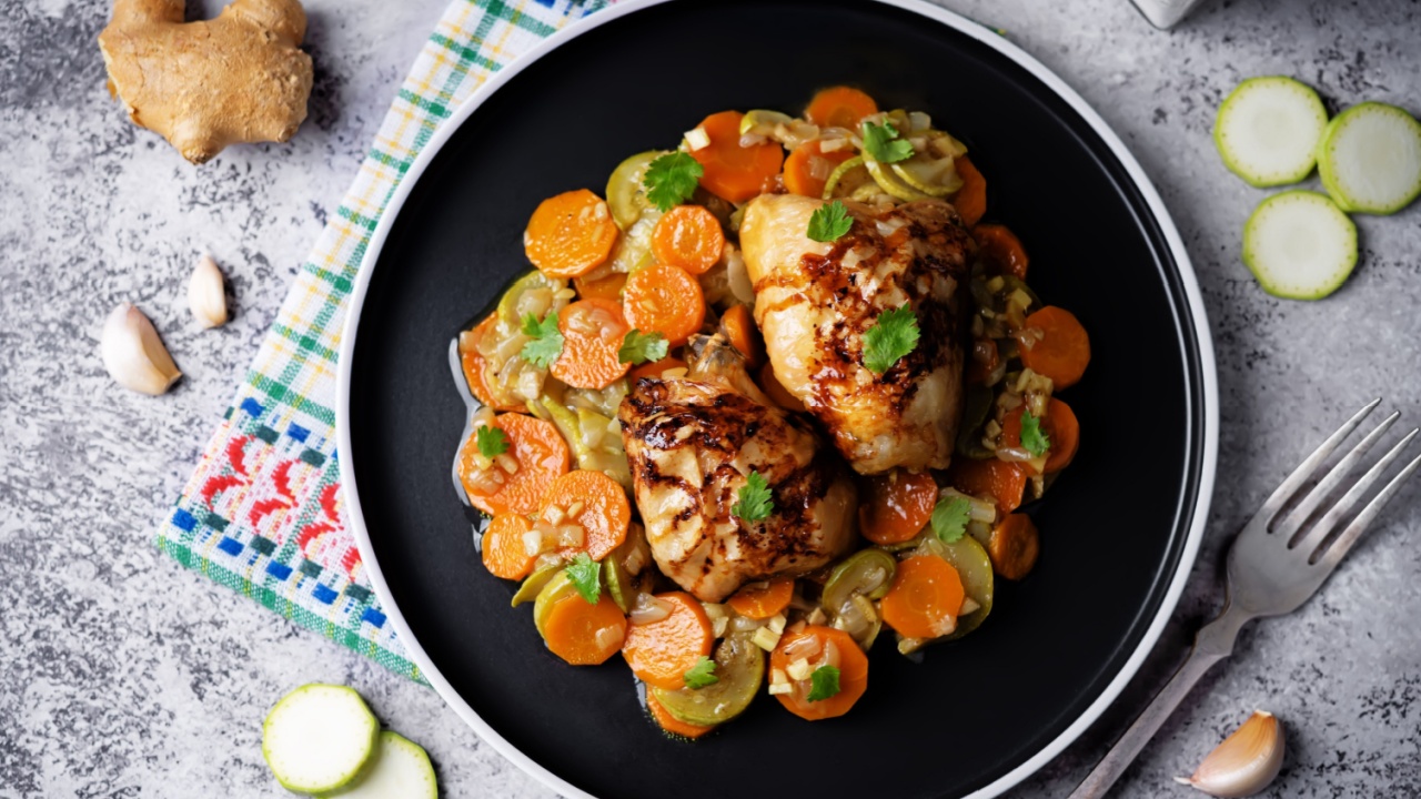 Moroccan spiced chicken with zucchini and carrots in a plate. toning